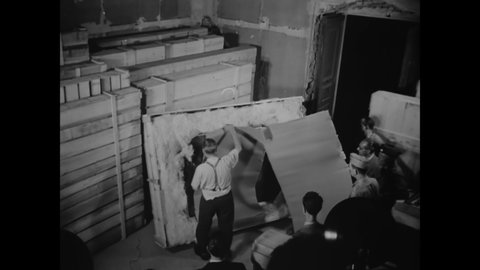 CIRCA 1940s - Soldiers uncrate stolen religious art, set to be returned to Florence, Italy.