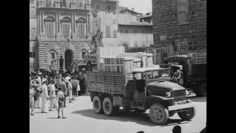 CIRCA 1940s - Soldiers drive trucks of stolen artwork being returned to Florence, Italy.
