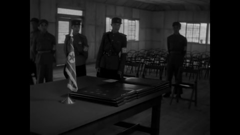 CIRCA 1953 - American generals arrive in Panmunjom to read the Korean Armistice Agreement, while UN troops stand guard.