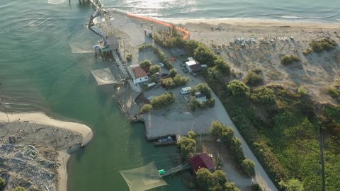 Aerial view of the fishing huts in the river that flows into the Adriatic sea, Lido di Dante, Fiumi Uniti, Ravenna near Comacchio valley.
