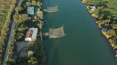 Aerial view of fishing huts in the river, Lido di Dante, Fiumi Uniti, Ravenna near Comacchio valley.