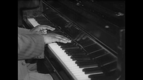CIRCA 1940s - Close-up of jazz pianist Art Tatum's fingers tickling the keys.