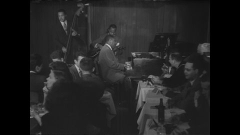 CIRCA 1940s - Art Tatum's jazz trio begins a set at the Three Deuces nightclub.