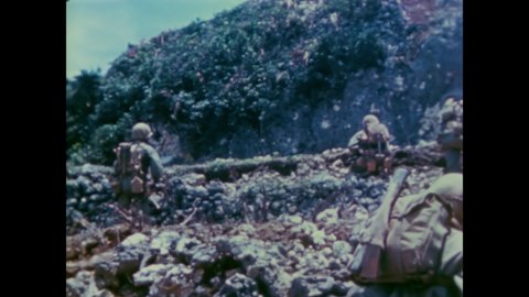 CIRCA 1945 - US Marines advance uphill in Okinawa.