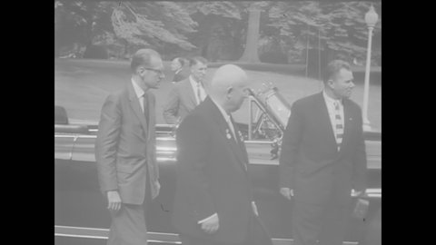 CIRCA 1959 - Nikita Khrushchev is met by President Eisenhower and Vice President Nixon at the White House in Washington DC.