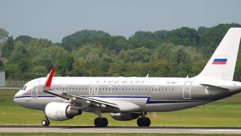 DUSSELDORF, GERMANY - JULY 22, 2017: Aeroflot Airbus 320 VP-BNT in retro livery braking after landing at Dusseldorf Airport, Germany (DUS)