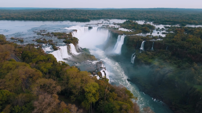 Beautiful aerial view of the Iguassu Falls from a helicopter, one of the Seven Natural Wonders of the World. Foz do Iguaçu, Paraná, Brazil. 4K. Royalty-Free Stock Footage #1081860302