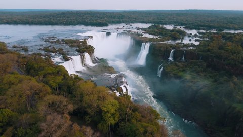 Beautiful aerial view of the Iguassu Falls from a helicopter, one of the Seven Natural Wonders of the World. Foz do Iguaçu, Paraná, Brazil. 4K.