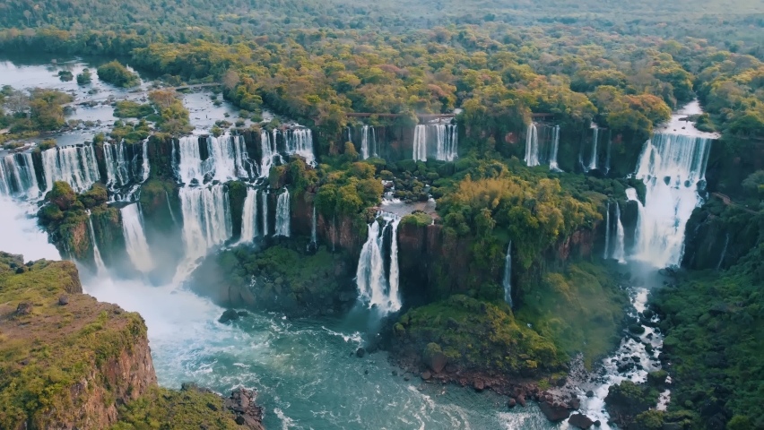 Beautiful aerial view of the Iguassu Falls from a helicopter, one of the Seven Natural Wonders of the World. Foz do Iguaçu, Paraná, Brazil. 4K. Royalty-Free Stock Footage #1081860338