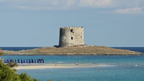 Stunning landscape with the Aragonese Tower and La Pelosa Beach bathed by a calm turquoise water. Spiaggia La Pelosa, Stintino, north-west Sardinia, Italy.	