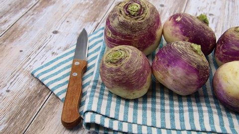 several raw turnips on a table	