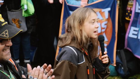 GLASGOW, NOV 2021 - Greta Thunberg says "We're gonna make a change!" at COP 26 in Glasgow, Scotland, UK while delivering an emphatic speech on a Fridays For Future event organized by activists


