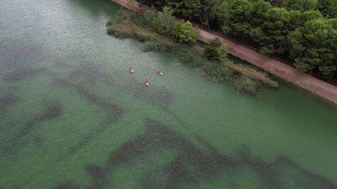 zoom out water sports in river drone view