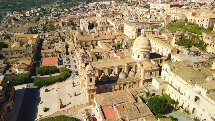 Aerial view of Cathedral of Noto, Chiesa Madre di San Nicolò, UNESCO world heritage site Sicilian Baroque. Drone flies above the Cathedral of Noto, Siracusa Sicily | Shutterstock HD Video #1081890728