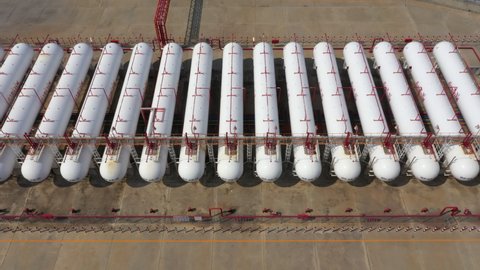 Aerial view natural white gas tank and pipeline, Tank storage chemical petroleum petrochemical refinery product at oil and gas storage terminal company.