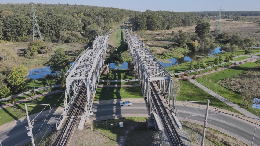 Railroad bridge and green forest.