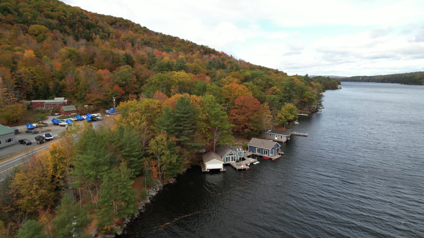 Sunapee Lake Lakefront, Newbury, New Hampshire USA. Drone Aerial View of Autumn Landscape and Houses on Water