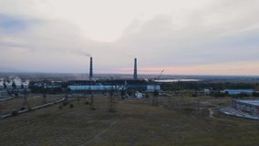 Video of a drone flying over a coal power plant, carbon dioxide emissions into the atmosphere. The threat of global warming.