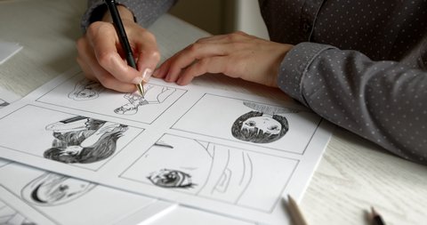An artist draws a storyboard for an anime comic book. Manga style.