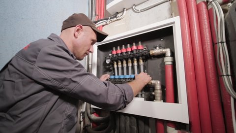 HVAC technician installs heating, ventilation and air conditioning systems