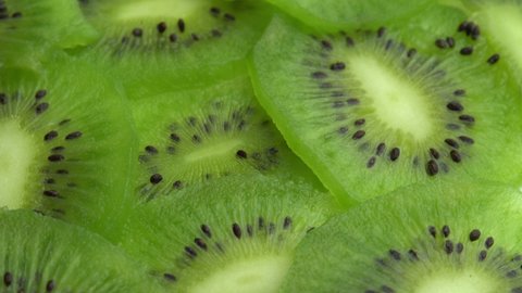 Background in the form of sliced kiwi spins, juicy green kiwi fruit or chinese gooseberry