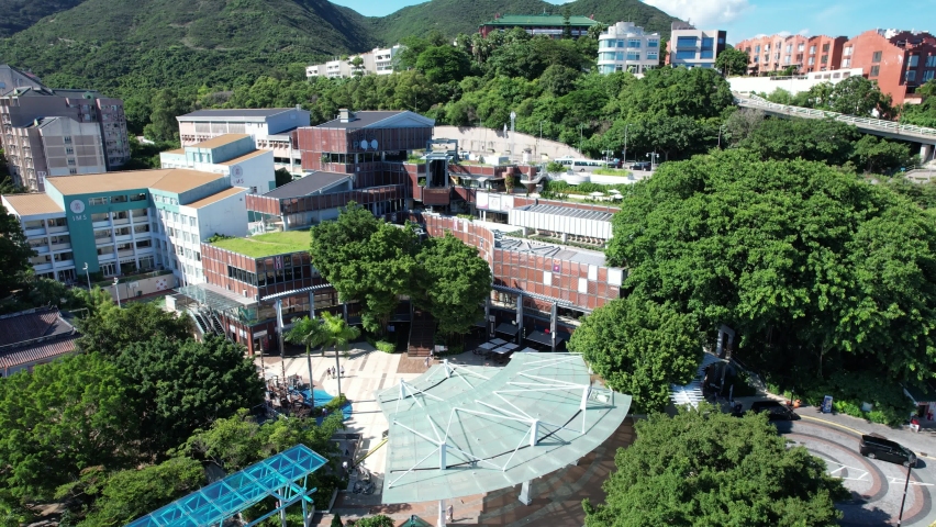 Stanley Market, a coastal town of Hong Kong, with traditional villages, beautiful scenery, water activities, beaches and islands, sea bay, pier and boats in-shore, aerial view