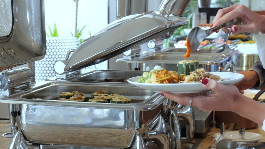 people serving food at a buffet Royalty-Free Stock Footage #1081945154