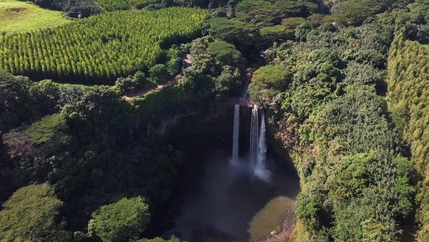 Aerial view the Wailua Falls in Kauai, Hawaii - high angle, orbit, drone shot Royalty-Free Stock Footage #1081946903