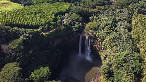 Aerial view the Wailua Falls in Kauai, Hawaii - high angle, orbit, drone shot