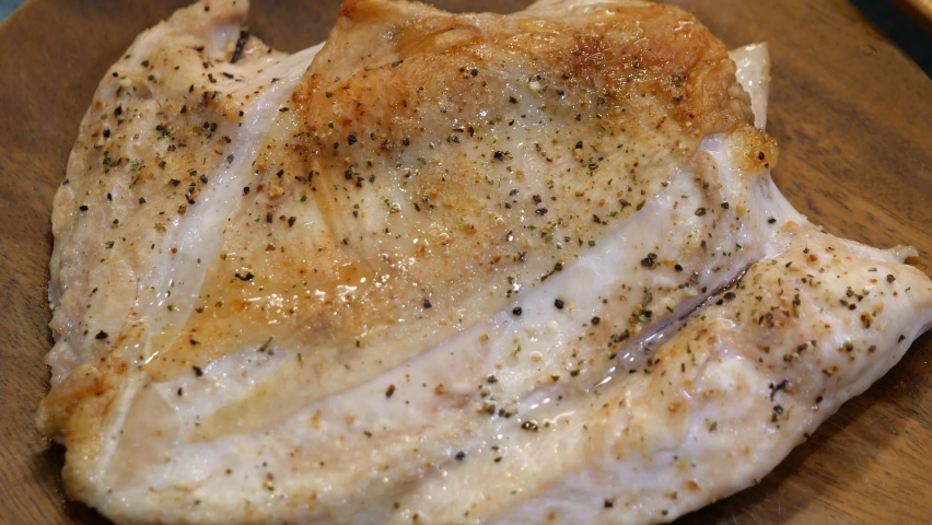 A video of cutting grilled chicken. | Shutterstock HD Video #1081949957