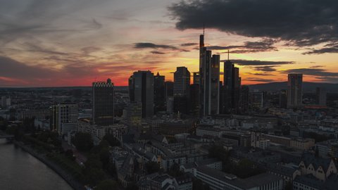 Colorful magical sunset, Establishing Aerial View Shot of Frankfurt am Main De, financial capital of Europe, Hesse, Germany, track left and back