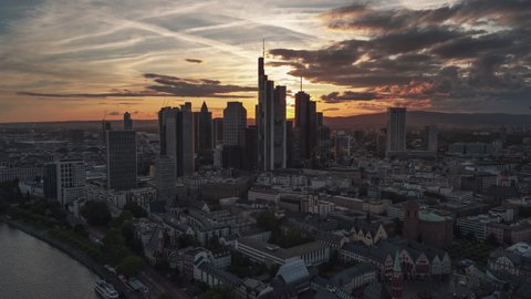 Establishing Aerial View Shot of Frankfurt am Main De, financial capital of Europe, Hesse, Germany, sun slowly going down, beautiful light, track in