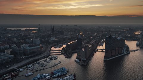 Hamburg, Germany - circa 2021; Magical Morning, Establishing Aerial View Shot of Hamburg De, Mecklenburg-Western Pomerania, Germany, Elbe River, slow track in, city waking up