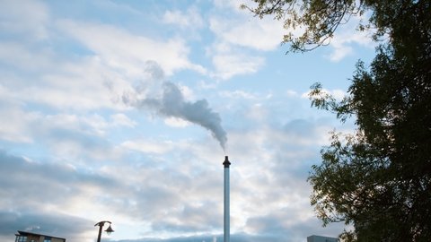 GLASGOW, NOV 2021 - On the occasion of COP 26, the UN Conference aimed at tacking Climate Change, a factory based in Glasgow, Scotland, UK is seen churning out a large plume of smoke into the air