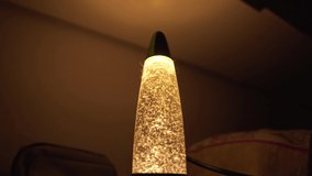 Old Green Lava Lamp with Particle Movement Inside. Romantic Evening Mood Created With Lighting Fixtures - Powered by Shutterstock - Get 15% off with code: PIKWIZARD15
