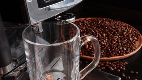 Footage of Pouring coffee stream from machine in cup. Home making hot Espresso. Using filter holder. Flowing fresh ground coffee. Drinking roasted black coffee in the morning.