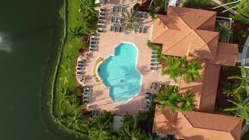 Luxury villa with swimming pool, Naples, Florida. Directly above ascending view  Royalty-Free Stock Footage #1081965617