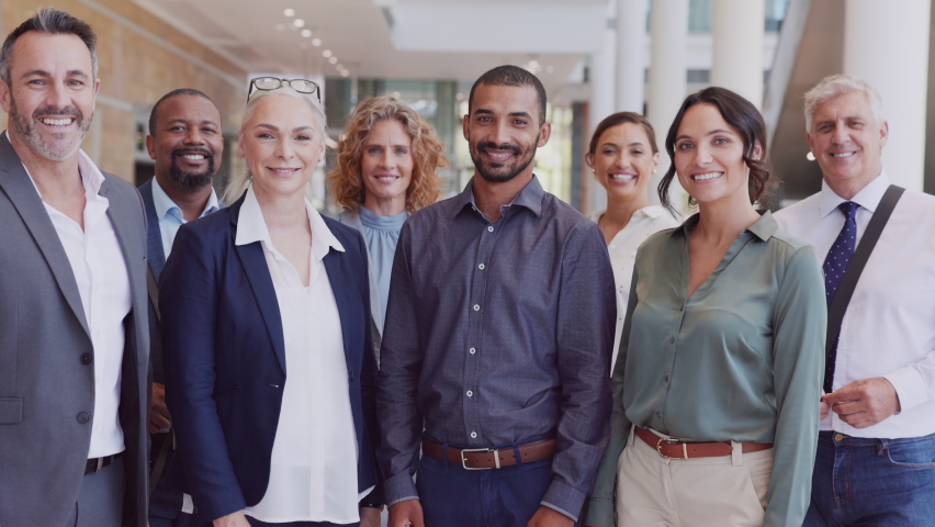 Group of happy multiethnic business people smiling and showing sign of success. Successful business team showing thumbs up and looking at camera. Portrait of proud businessmen and businesswomen. Royalty-Free Stock Footage #1081987013