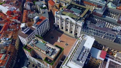 Aerial view of the Borsa Piazza Affari. Krishi houses in the city. Attractions for tourists. A crisis. Statue of the middle finger on the hand. Finance. Architecture. Italy, Milan, november 2021
