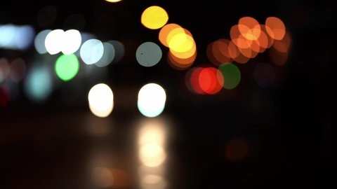 Blurred abstract bokeh of city night light background on a beautiful evening street in Moscow. Nightlife with bus and cars out of focus. Street. City. Urban scene. Defocused