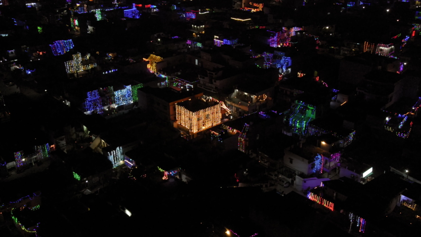 Aerial view of decoration lights on Diwali night in an Indian city. Drone view of Diwali night with twinkling electric lights. 360-degree night aerial view. Diwali night aerial view. India from above. Royalty-Free Stock Footage #1081994915