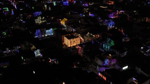 Aerial view of decoration lights on Diwali night in an Indian city. Drone view of Diwali night with twinkling electric lights. 360-degree night aerial view. Diwali night aerial view. India from above.