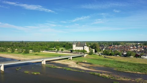 The Loire in flood and the castle of Sully sur Loire in Europe, in France, in the Center region, in the Loiret, in summer, on a sunny day.