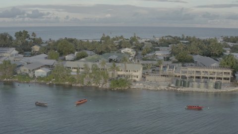 Drone footage of Pacific Island nation Tuvalu which is suffering from climate change and rising sea waters. A beautiful beachside and city landscape that is afflicted with a modern problem.