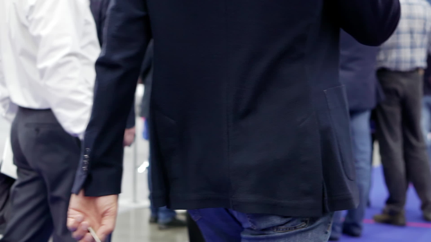 People walk past the camera.