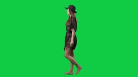 Side view of happy relaxed woman in tunic and hat walking and looking up. Full body isolated on green screen background - Powered by Shutterstock - Get 15% off with code: PIKWIZARD15