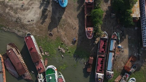 Aerial over beached hulks in various states of ship breaking - illegal site