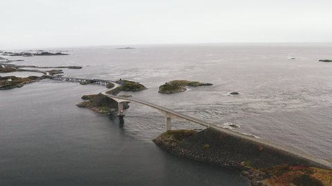 View Of Storseisundet Bridge And Atlantic Ocean Road On A Cloudy Day In Norway - drone shot