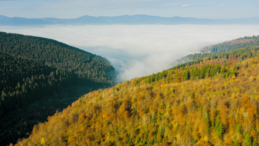 Aerial Foggy Autumn Mountains Landscape in Alpine Nature at Sunny Morning - Hyperlapse