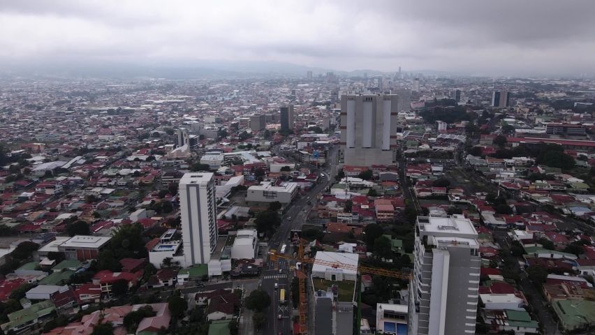 Grey storm clouds over the city of San Jose in Costa Rica. Aerial view